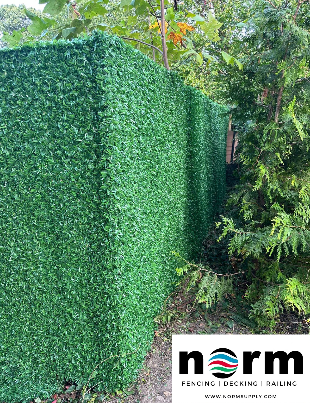 High-density green grass fence rolls for low-maintenance landscaping – available at Norm Atlanta.