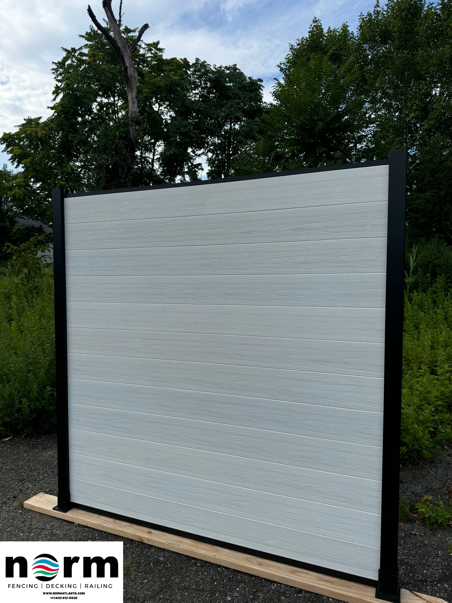 Modern WPC composite fence providing privacy and weather resistance.