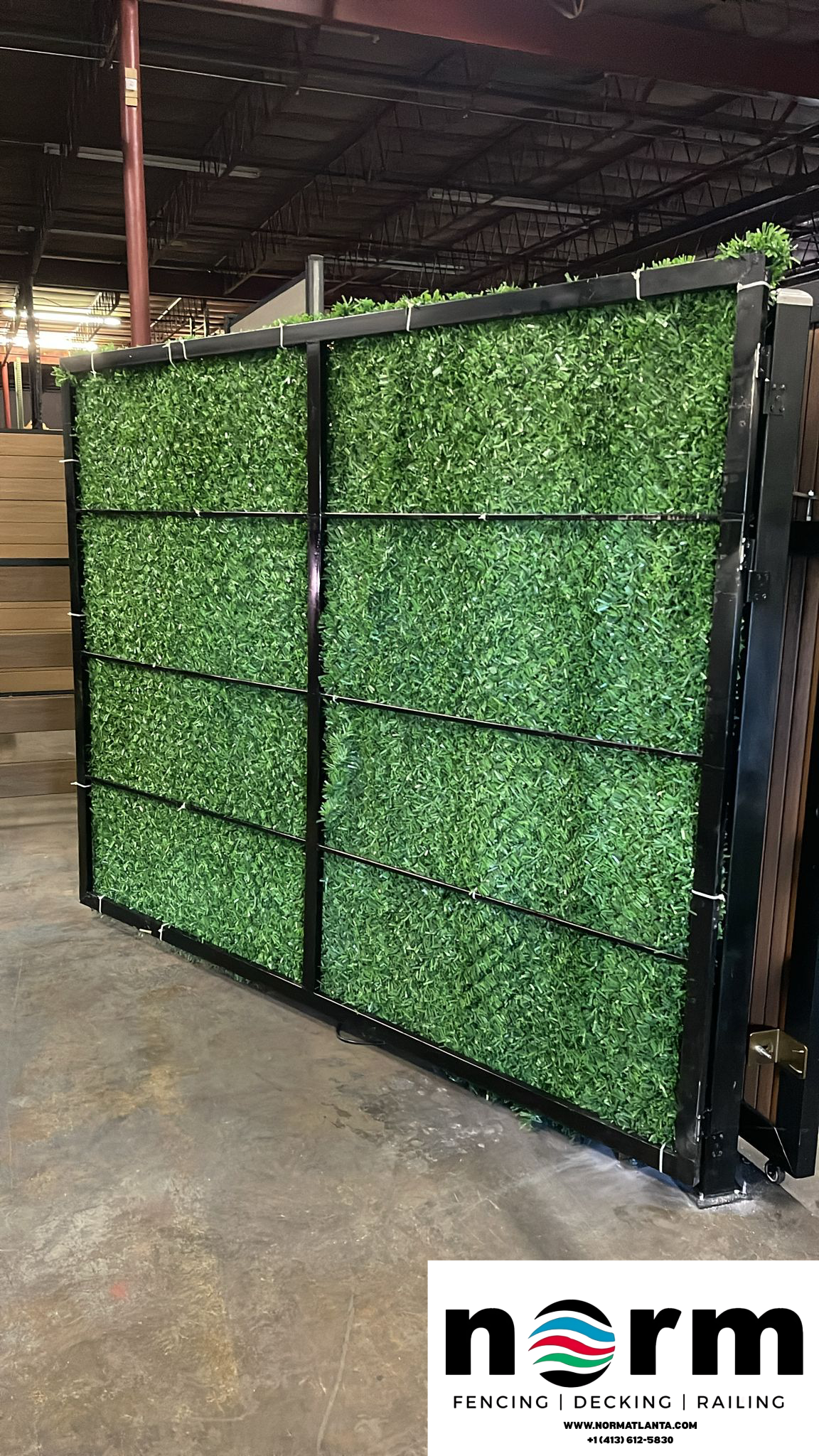 Sliding grass gate in front of modern house entrance