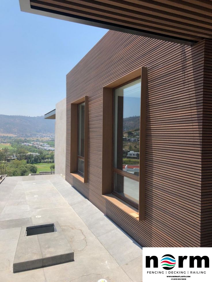 Stylish garden wall with wooden-look panels