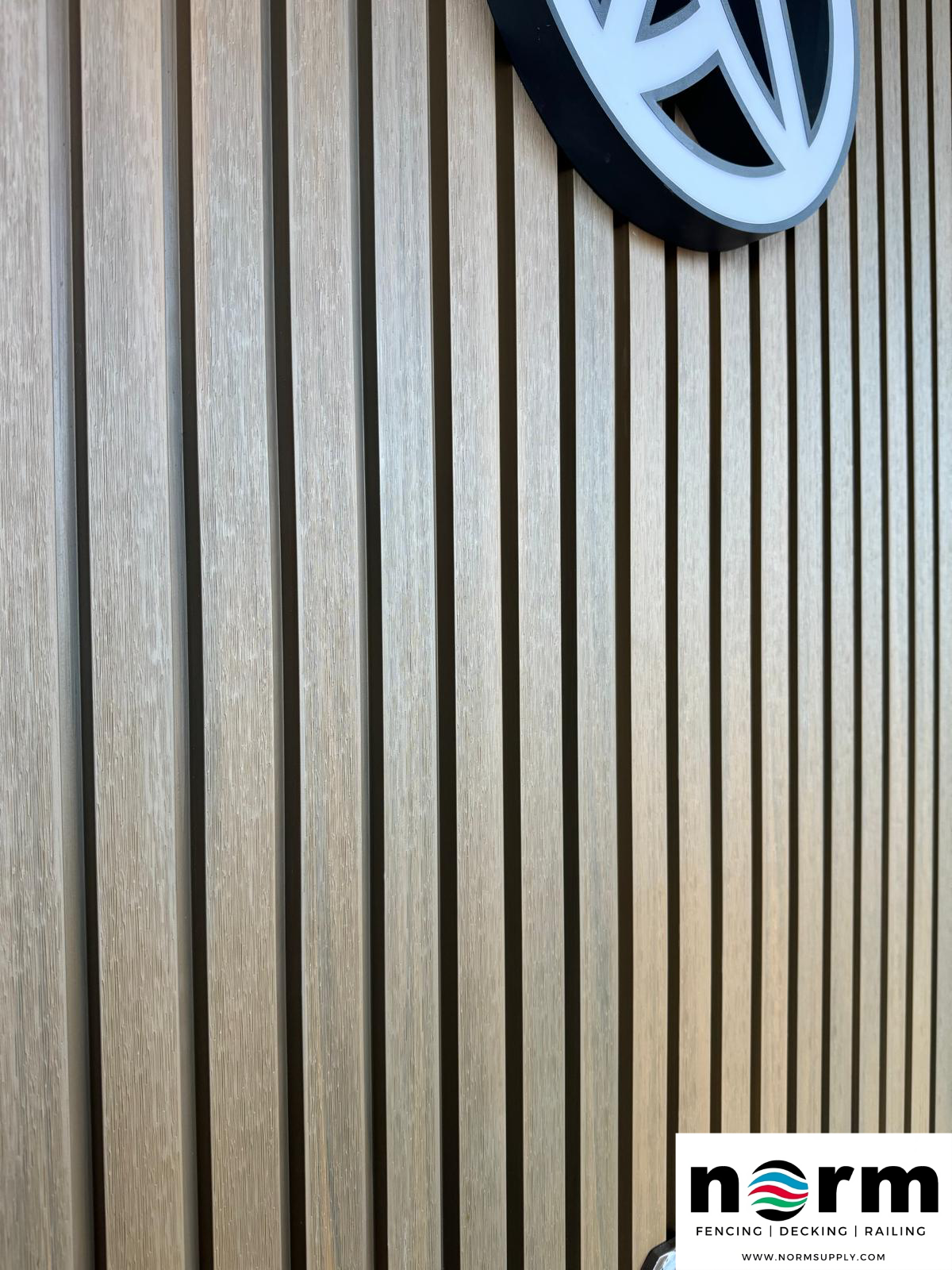 Vertical acoustic wall panels in oak finish for indoor use